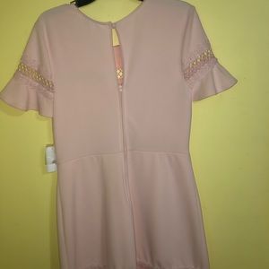 B Darlin beautiful pink 95% polyester 5%spandex. Lace exclusive of decoration.